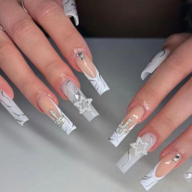 Artificial nails with luxurious marble design and radiant embellishments Bowlift