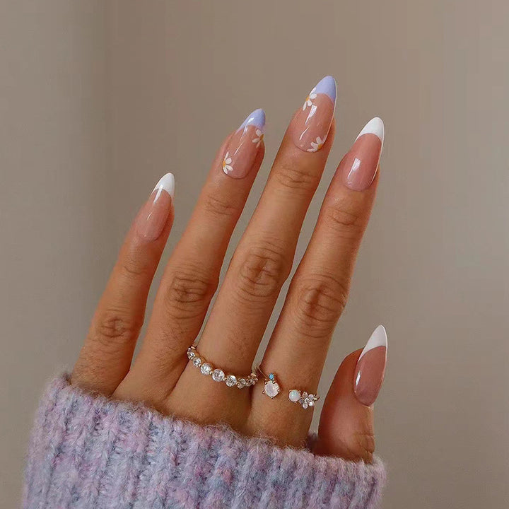 Elegant artificial nail design with delicate flower and ombre effects Bowlift