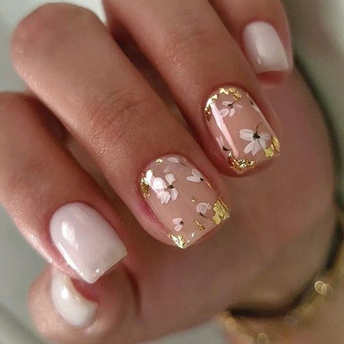 Artificial nail art with delicate flowers and glitter accents Bowlift