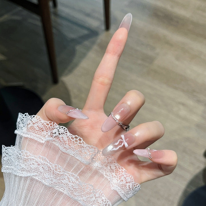 Elegant Long Press-On Nails with Decorative Accents Bowlift