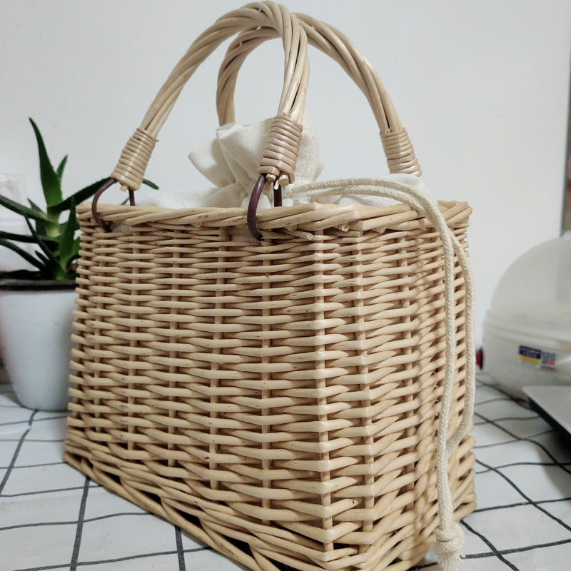 Women's handbag made of braided material with cotton drawstring closure Bowlift