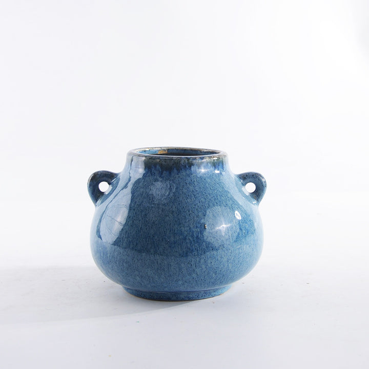 Decorative ceramic pot with playful handles Bowlift