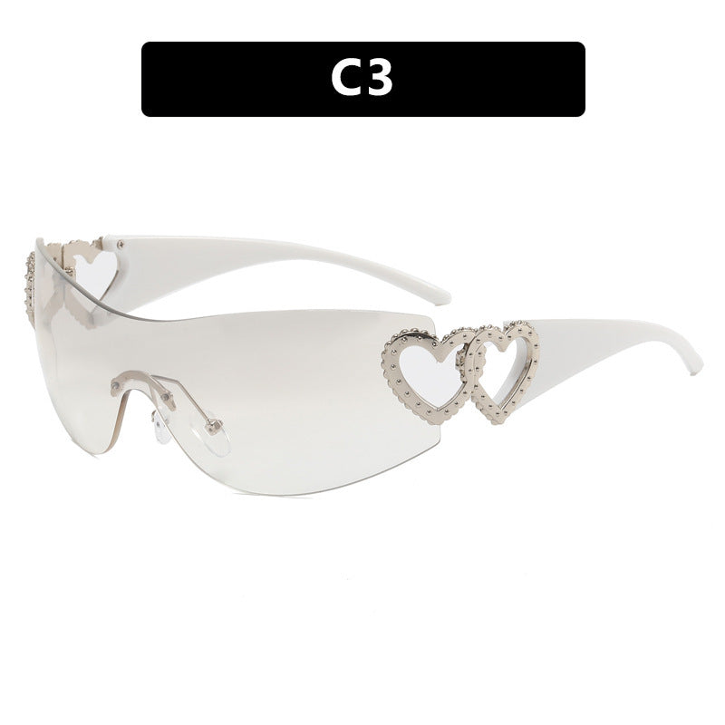 Ladies sporty sunglasses in trendy shield design with heart accents Bowlift