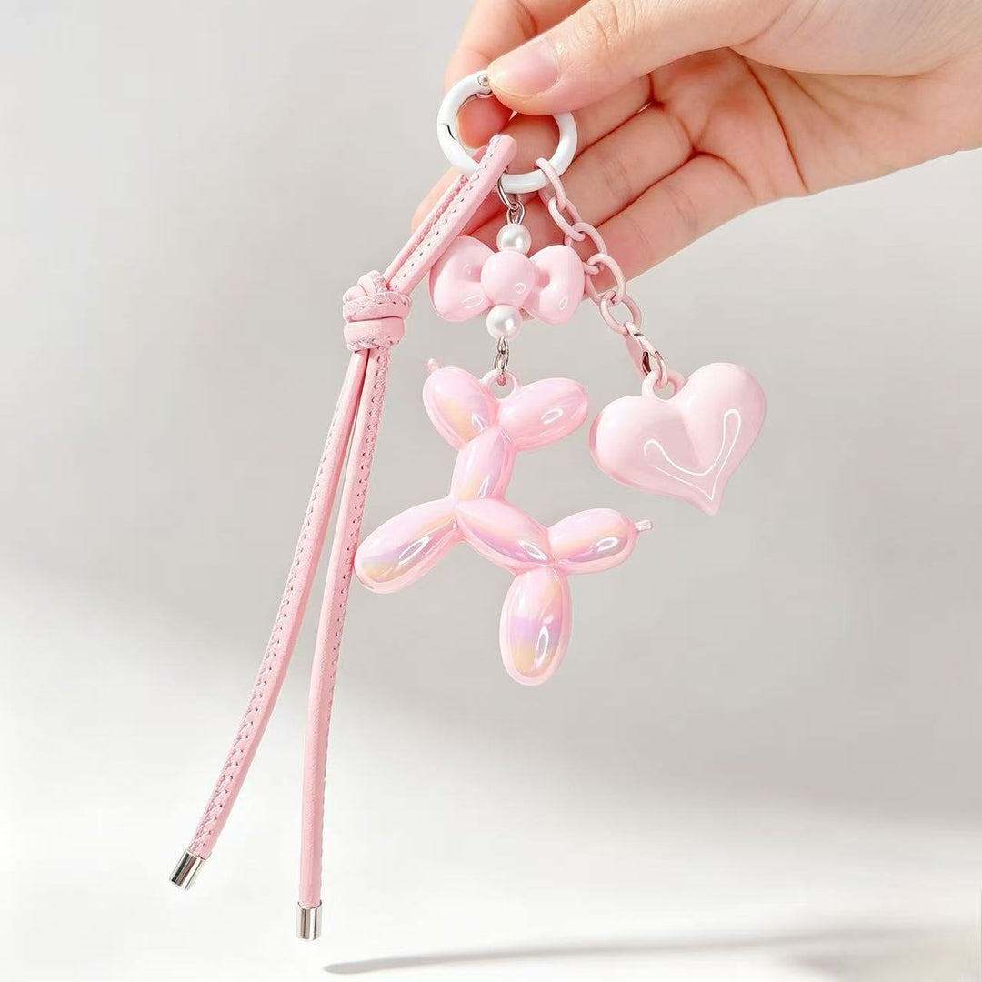 Playful keychain with heart and balloon dog Bowlift