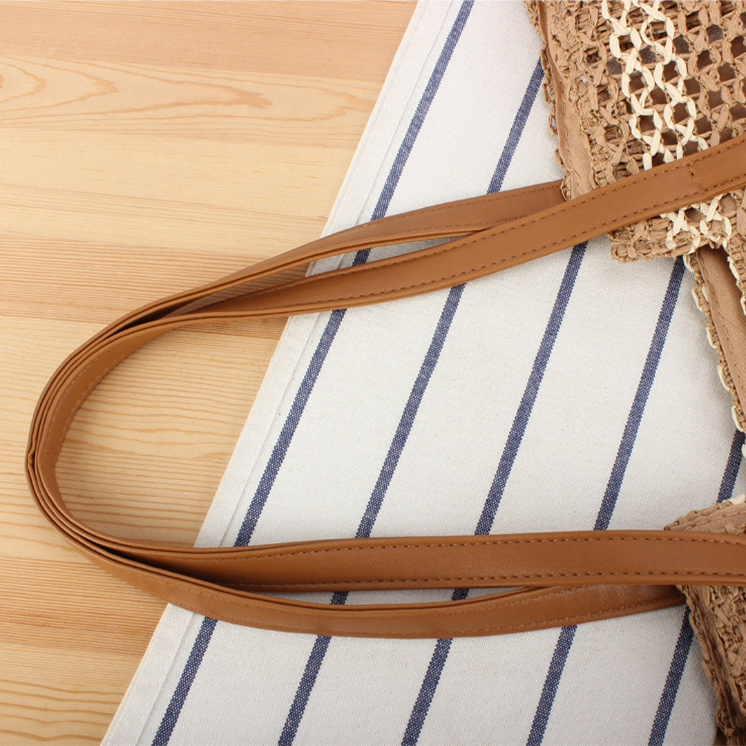 Shopping bag made of woven natural material with elegant leather handles Bowlift