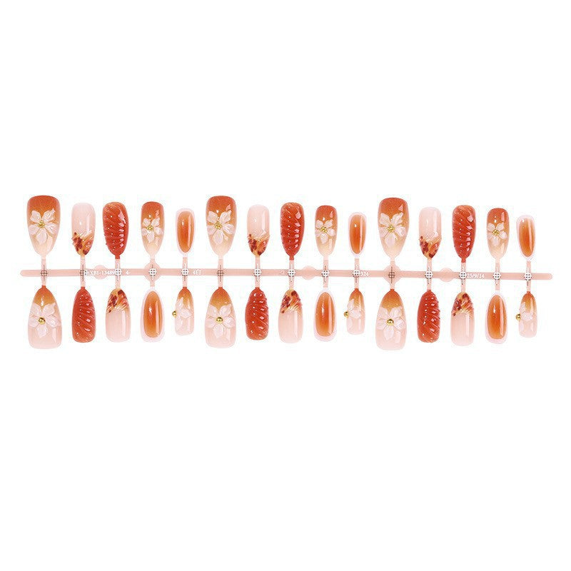 Artificial nail set with handcrafted flowers and elegant embellishments Bowlift