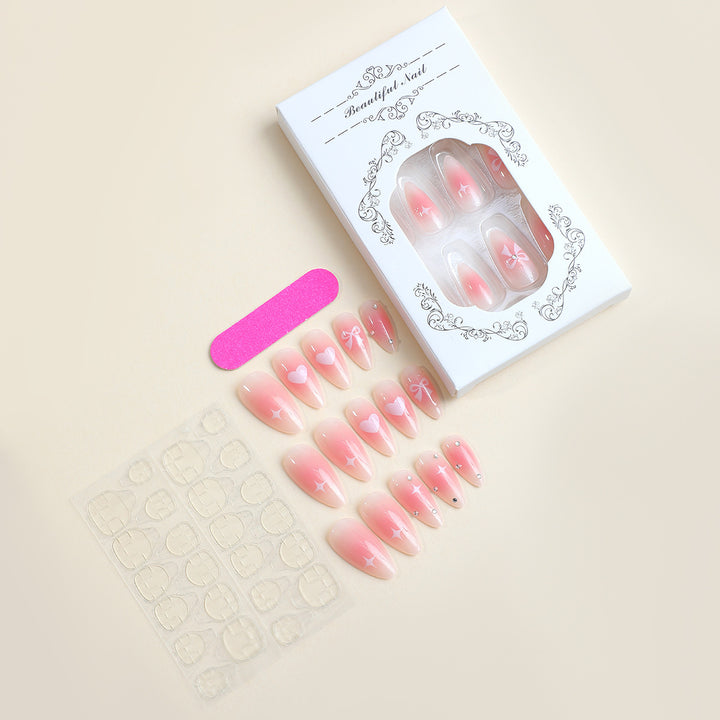 Acrylic nail set with romantic heart and bow design Bowlift