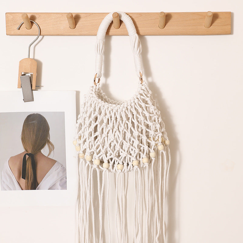 Macrame bag with decorative fringes and wooden beads Bowlift