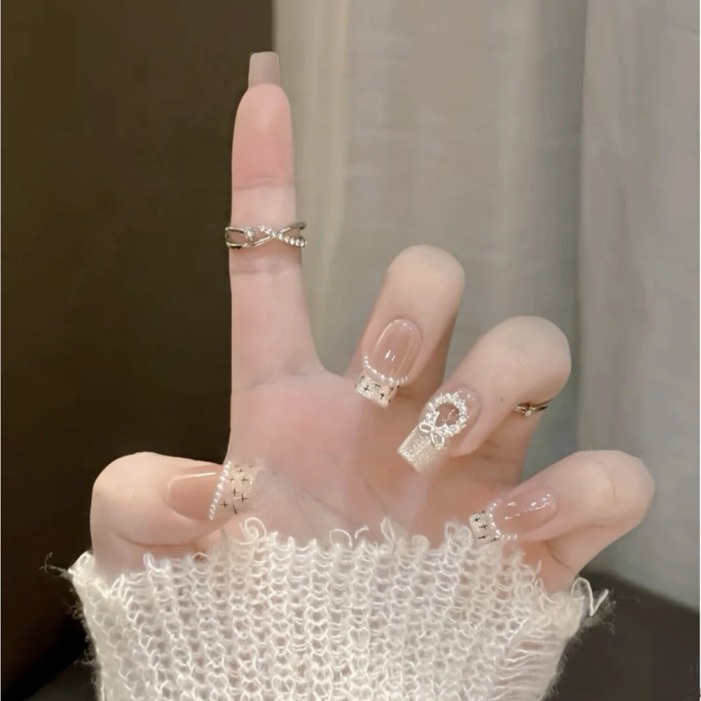 Glamorous artificial nails with sparkling decorations Bowlift