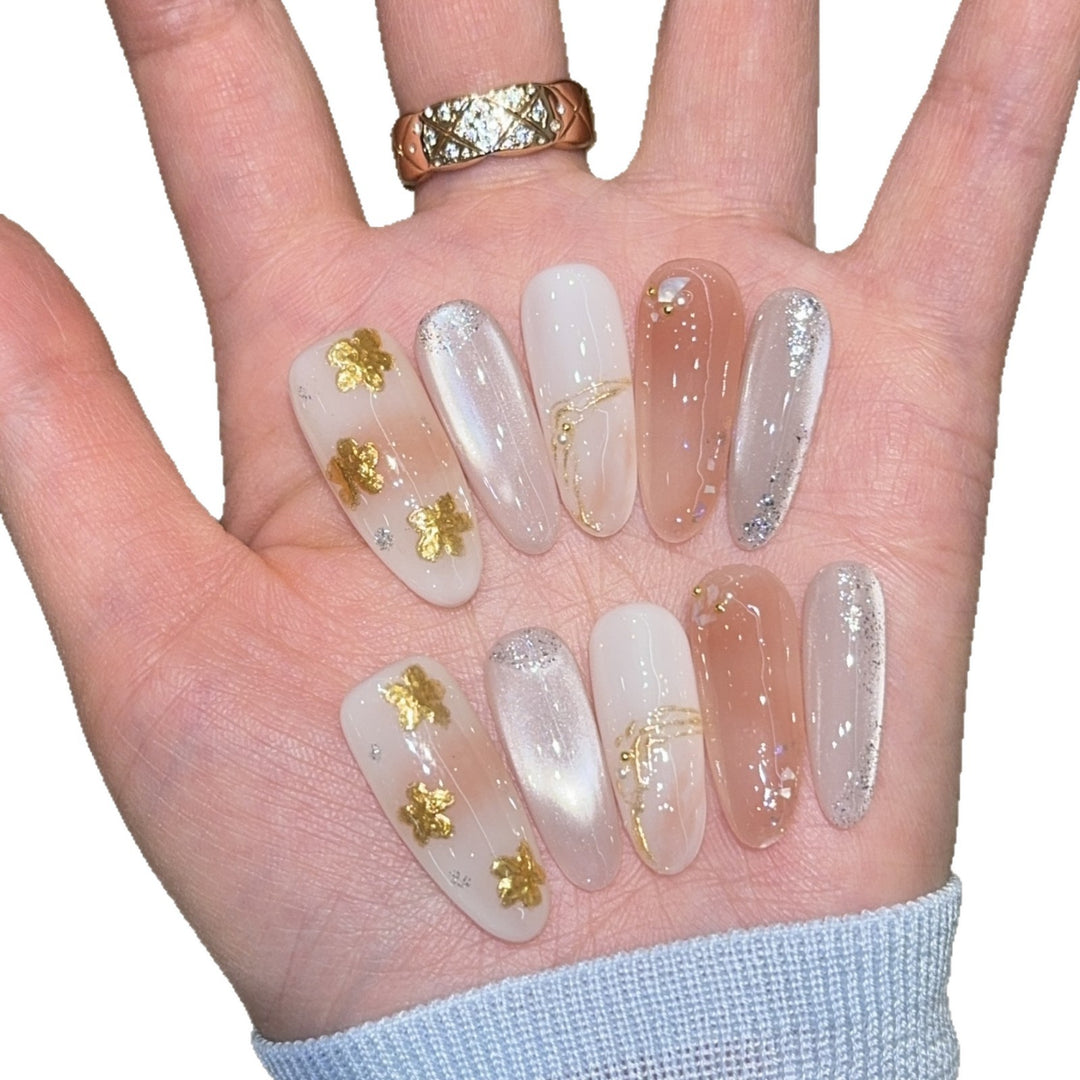 Artificial nails with floral decorations and glitter effects Bowlift