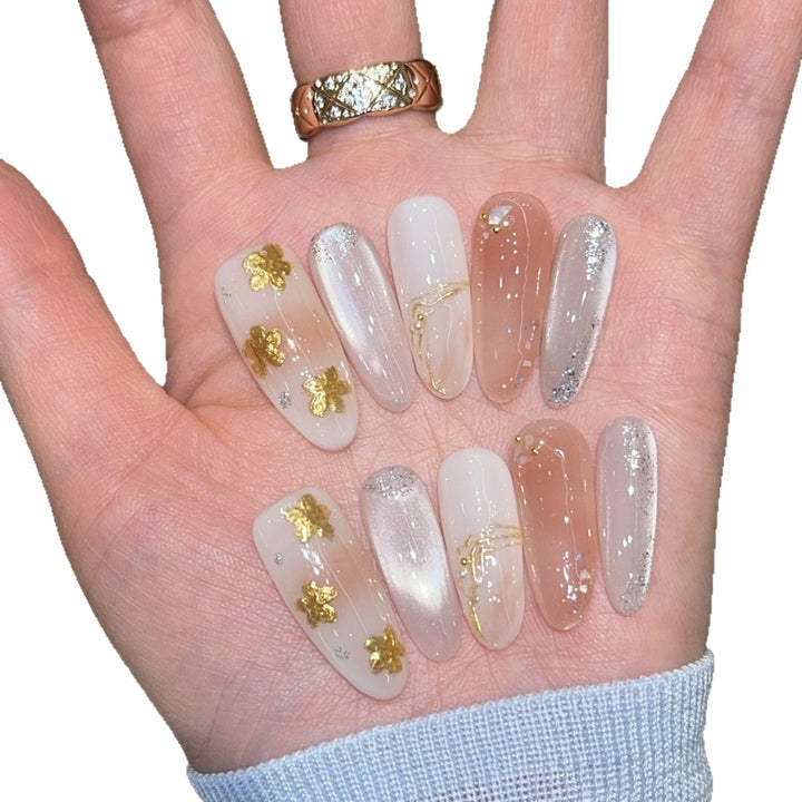 Artificial nails with floral decorations and glitter effects Bowlift