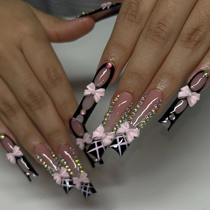 Artistic acrylic nails with floral design and rhinestone bow Bowlift