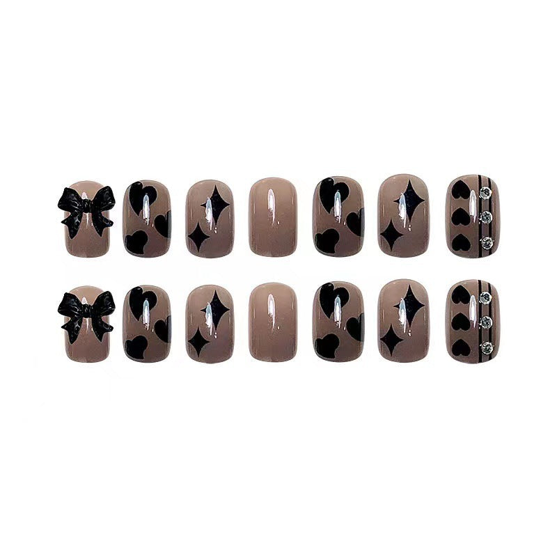 Artificial nails with elegant ribbon and heart designs Bowlift
