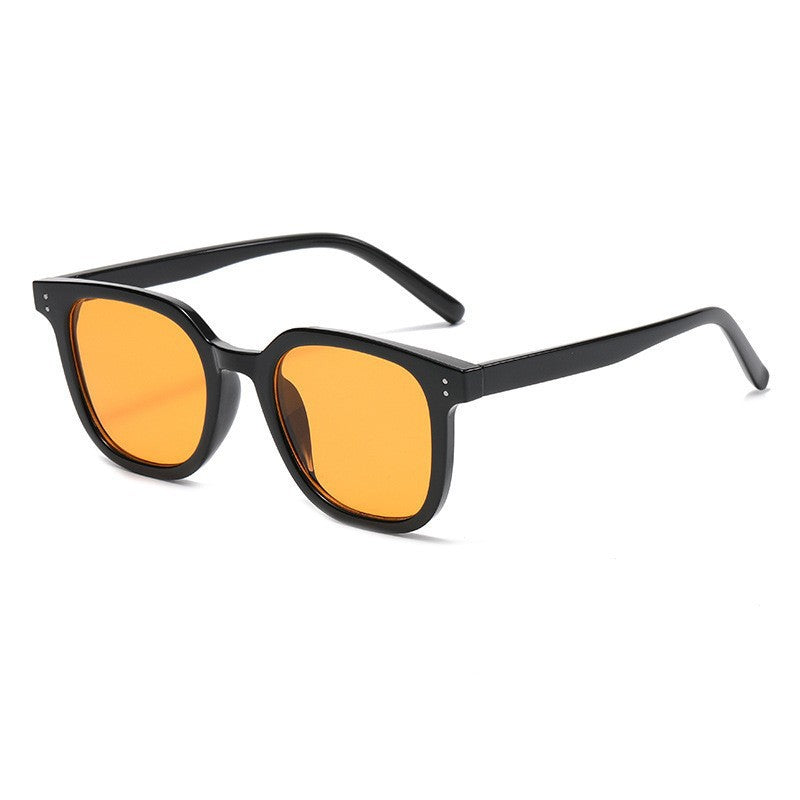 Women striking retro sunglasses with yellow-tinted lenses Bowlift