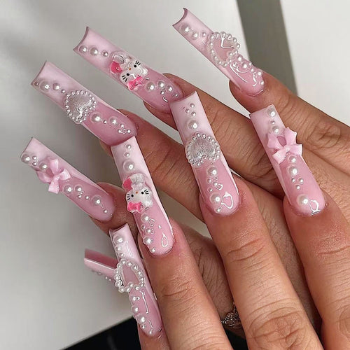 Artificial nail set with playful 3D care and pearl decorations Bowlift