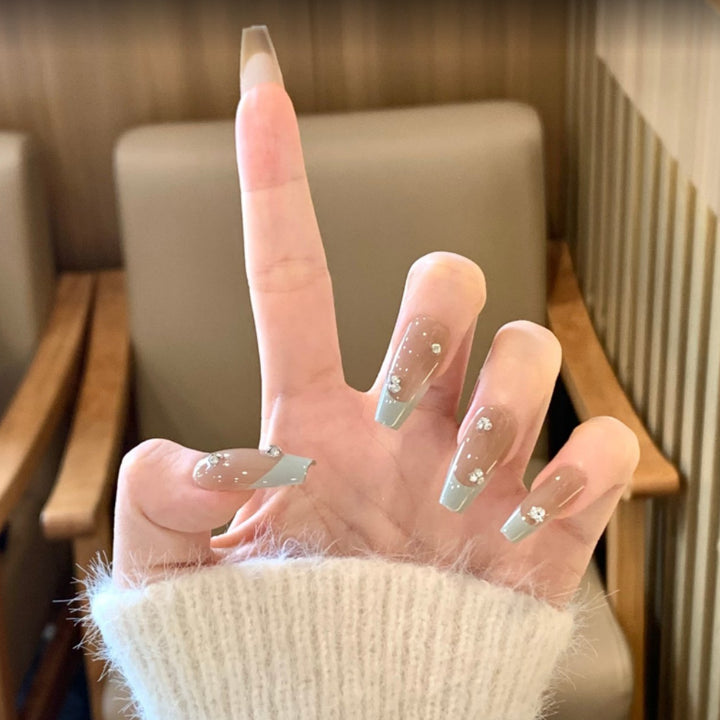 Artistic Long Stiletto Press-On Nails with Floral and Gemstone Accents Bowlift