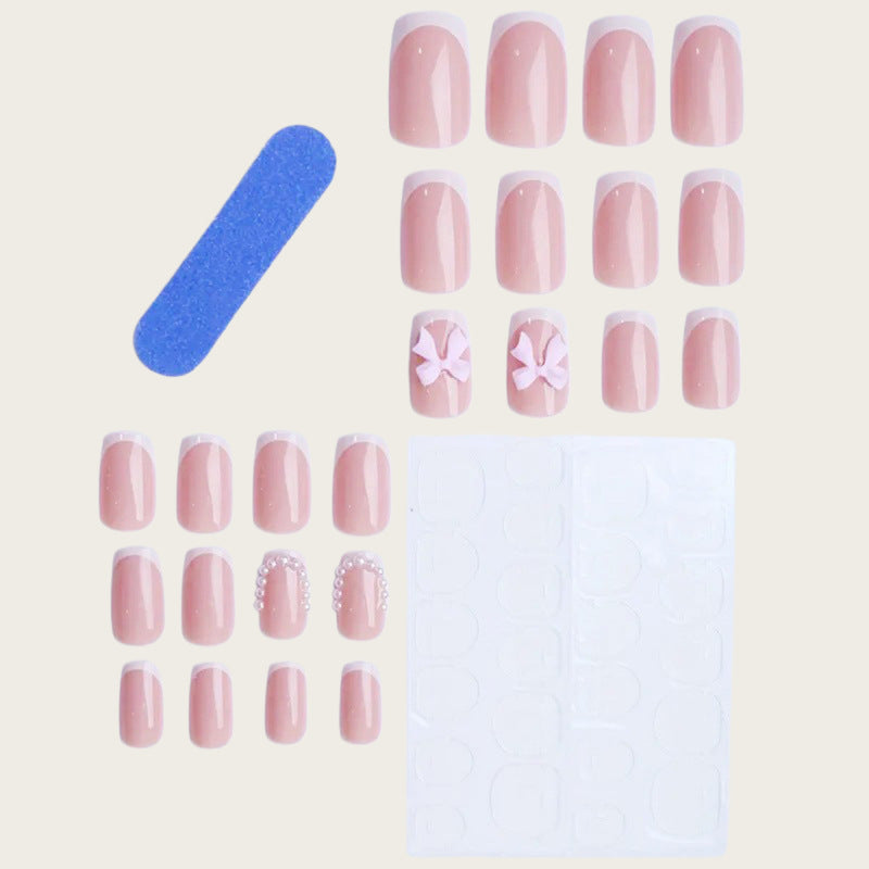 Exclusive artificial nails with decorative bows and pearl details Bowlift