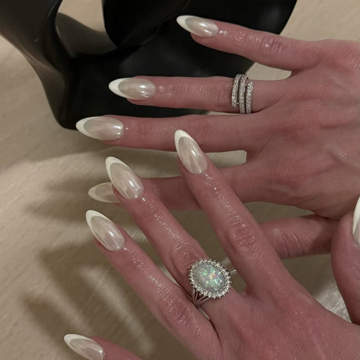 Artistic stiletto nails with elegant French tip embellishments Bowlift
