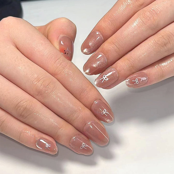 Artificial nail extensions with cute bunny design and hearts Bowlift