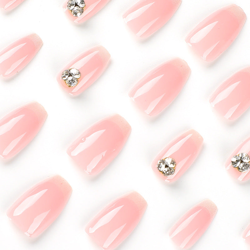 Artful nail extensions with elegant French tip and rhinestone embellishments Bowlift