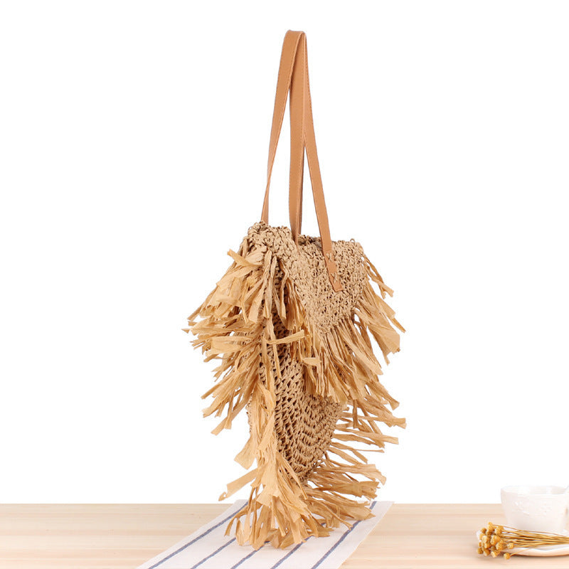 Bast crossbody bag with fringed design Bowlift