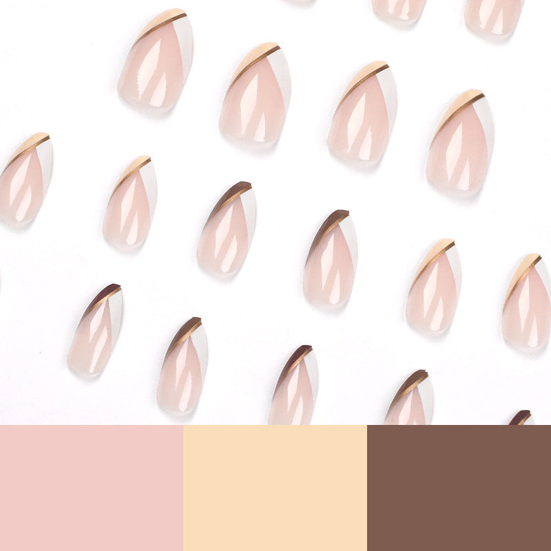 Artful nail art in elegant stiletto design with golden accents Bowlift