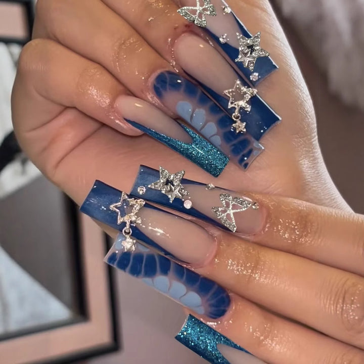 Glamorous artificial nail tips with adorned stars and glitter Bowlift