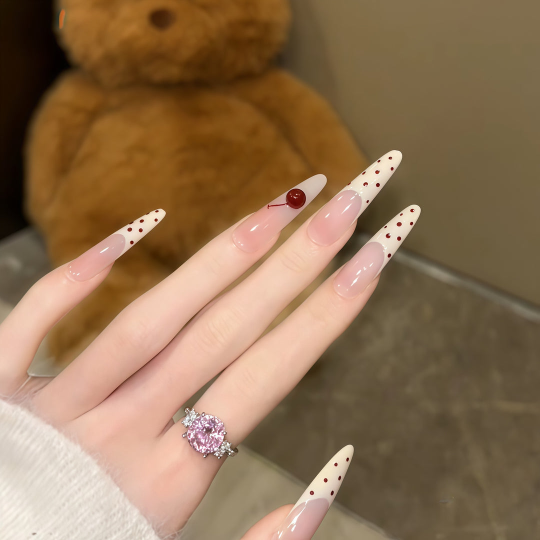 Artificial nails with playful design and cherry accents Bowlift