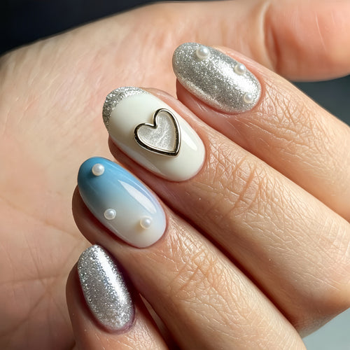 Glamorous artificial nails with heart design and pearl details Bowlift