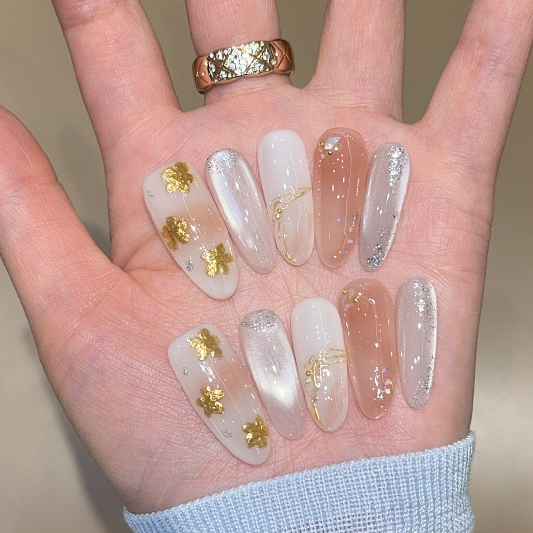Artificial nails with floral decorations and glitter effects Bowlift