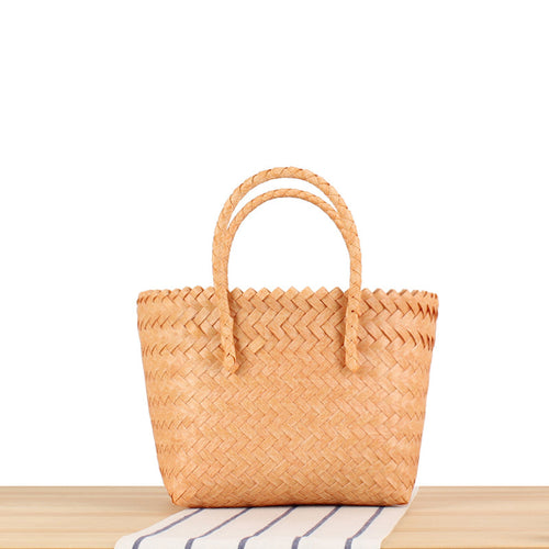 Tote bag made of handwoven natural material with braided design Bowlift