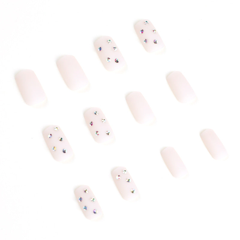 Artistic nail art with elegant rhinestone embellishments Bowlift