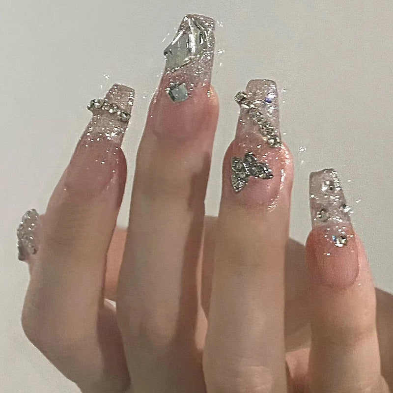 Glamorous artificial nails with delicate flower and glitter effects Bowlift