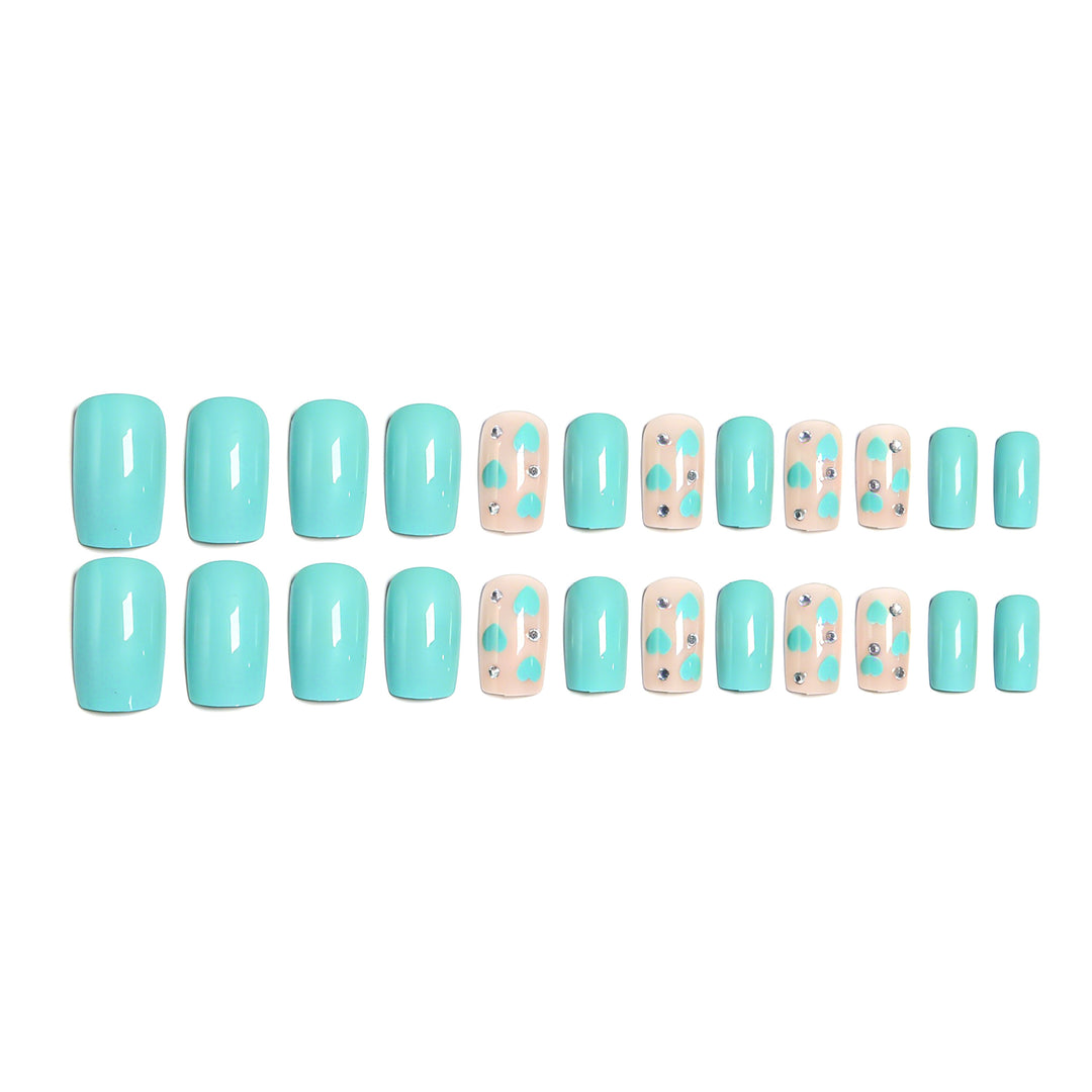 Nail art with heart designs and glitter accents Bowlift