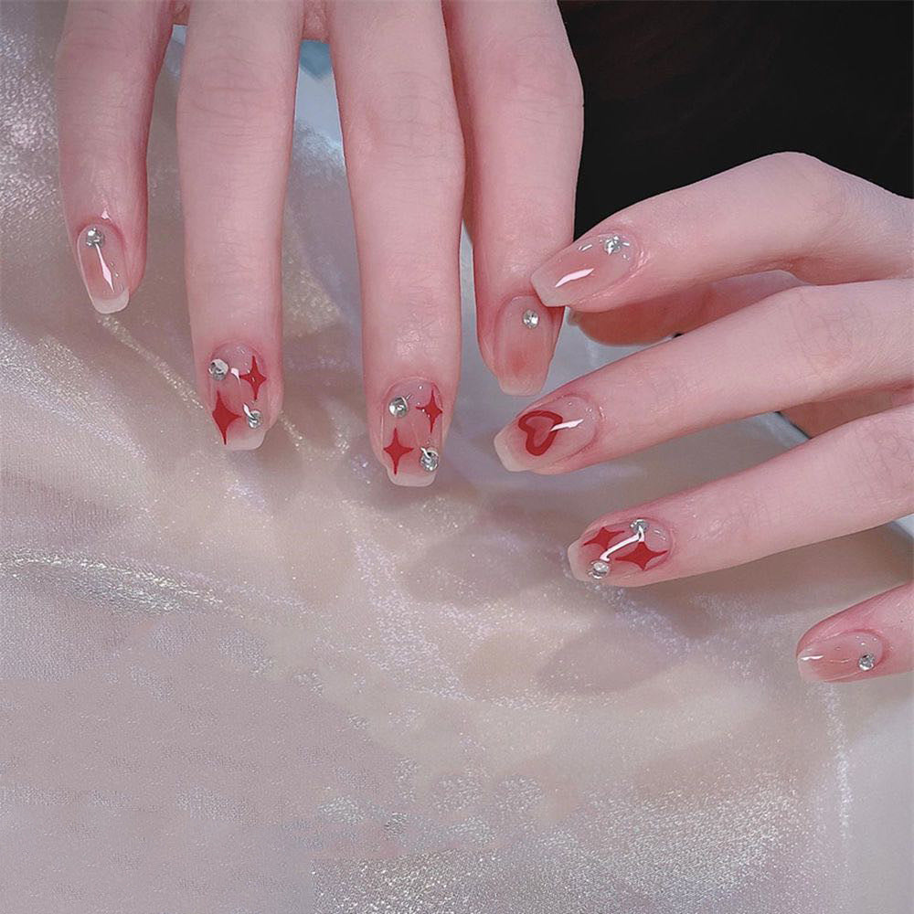 Nail art set with sparkling rhinestone details and heart motifs Bowlift
