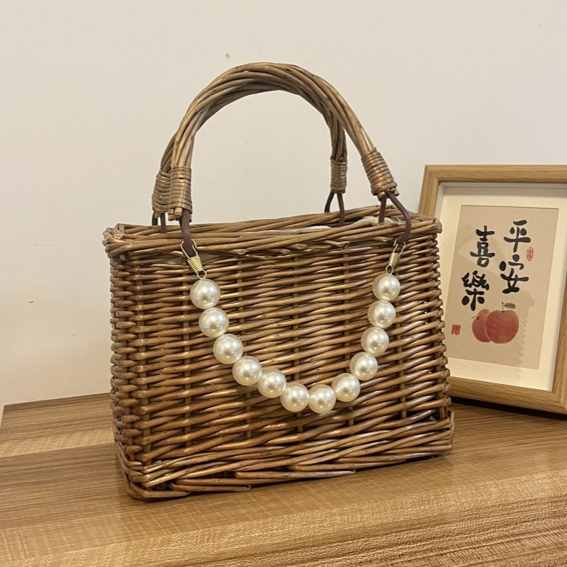Ladies' basket bag with decorative pearl accents and bow decoration Bowlift