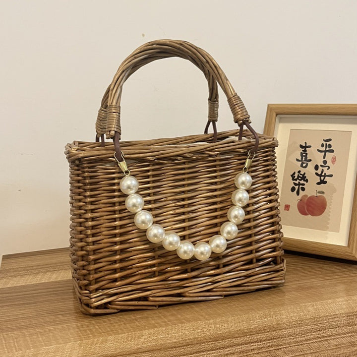 Ladies' basket bag with decorative pearl accents and bow decoration Bowlift