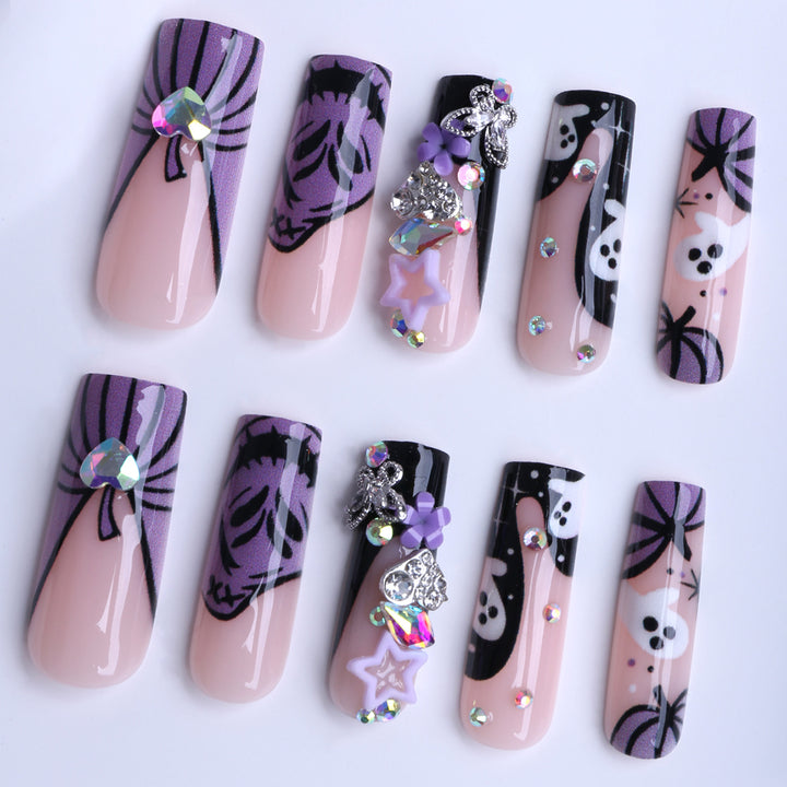 Artificail nails with creative Halloween design and glitter accents Bowlift