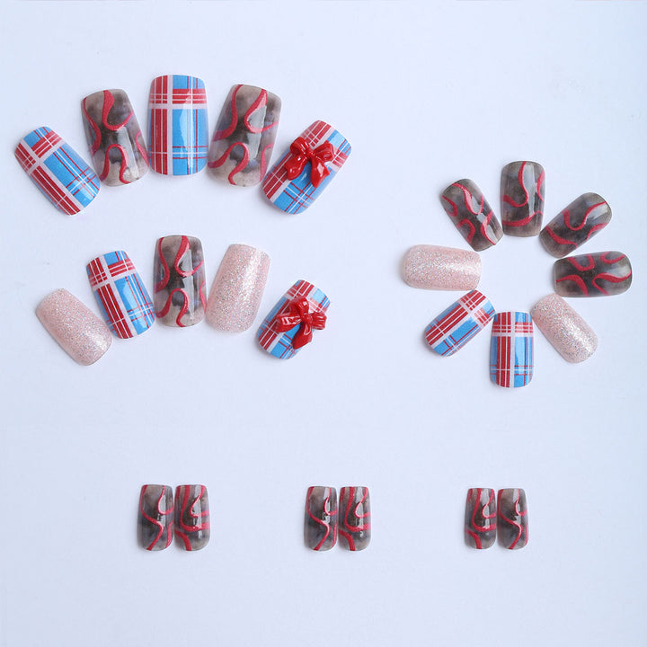 Artificial nails with festive gift design and glitter Bowlift