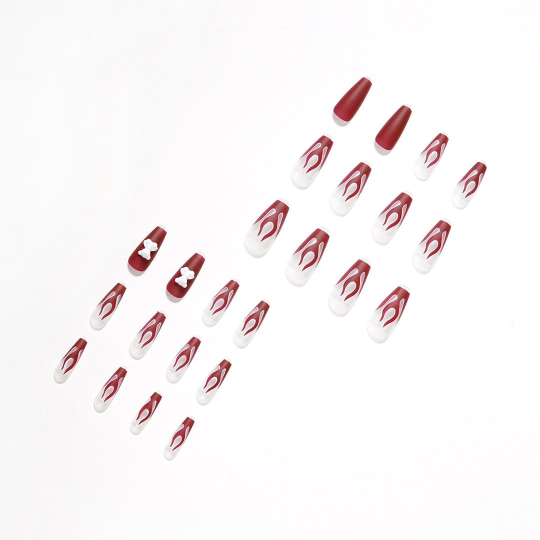 Artful stiletto nails with fiery flame design Bowlift