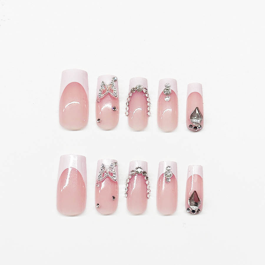 Acrylic nail set with elegant rhinestone and glitter decorations Bowlift