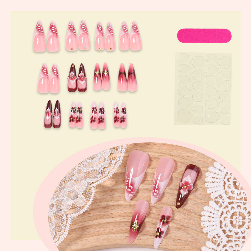 Artifical nail set with delicate floral design and glamorous accents Bowlift