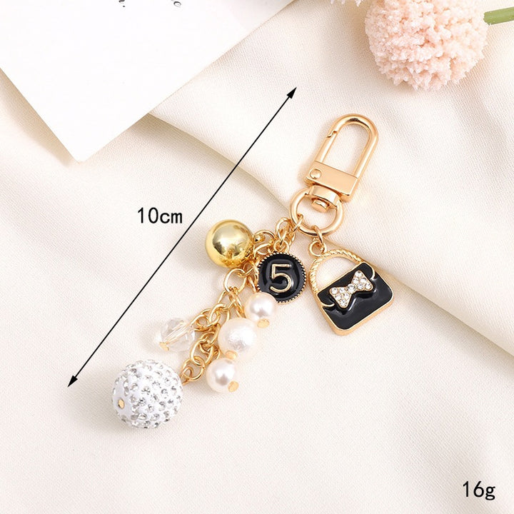 Playful keychain with teddy bear motif Bowlift