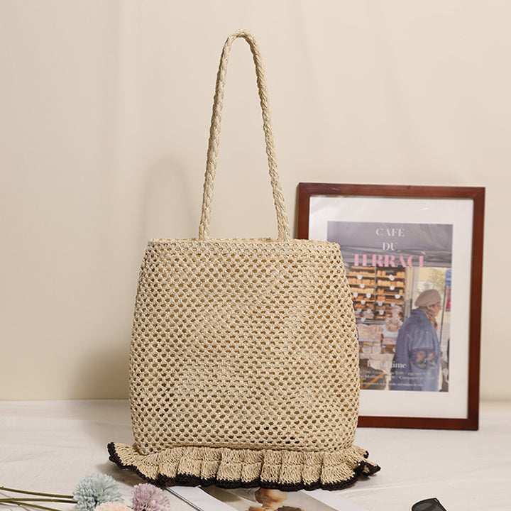 Handcrafted straw bag with fringed hem Bowlift