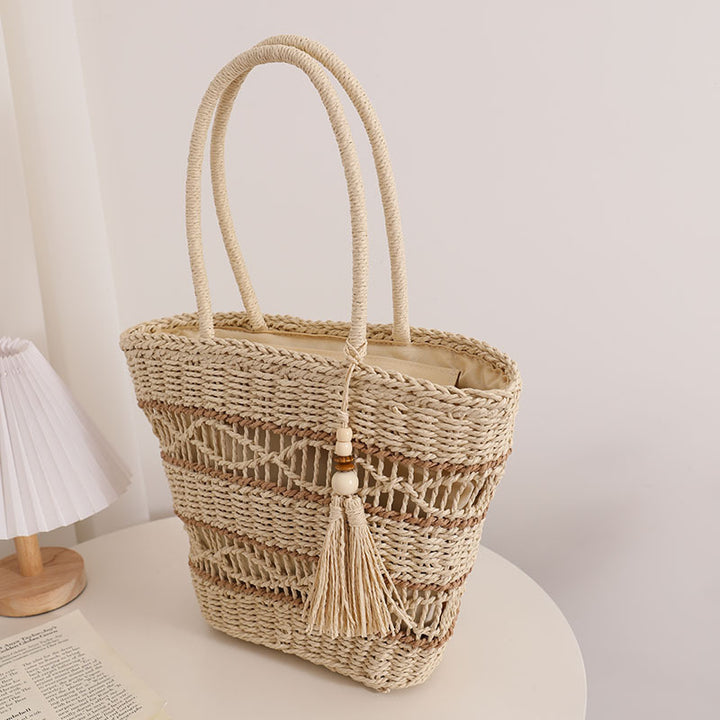 Handcrafted straw tote bag with decorative tassel detail Bowlift