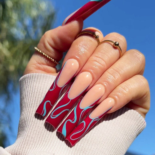 Artistic acrylic nails with floral and graphic accents Bowlift