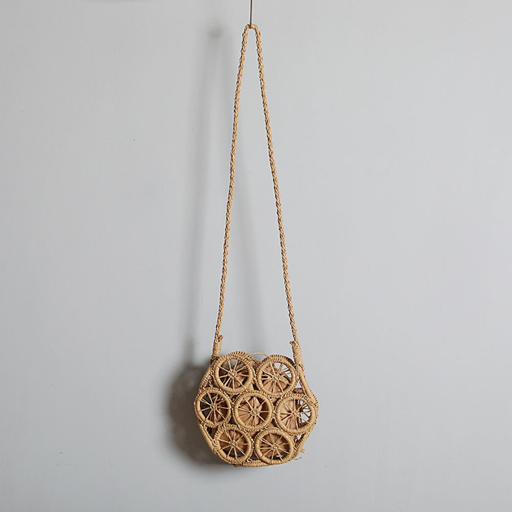 Shoulder bag made of handwoven raffia with intricate embellishments Bowlift