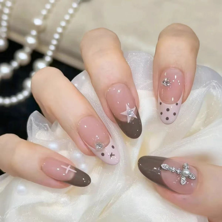 Artistic Press-On Nail Design with Floral and Gemstone Accents Bowlift
