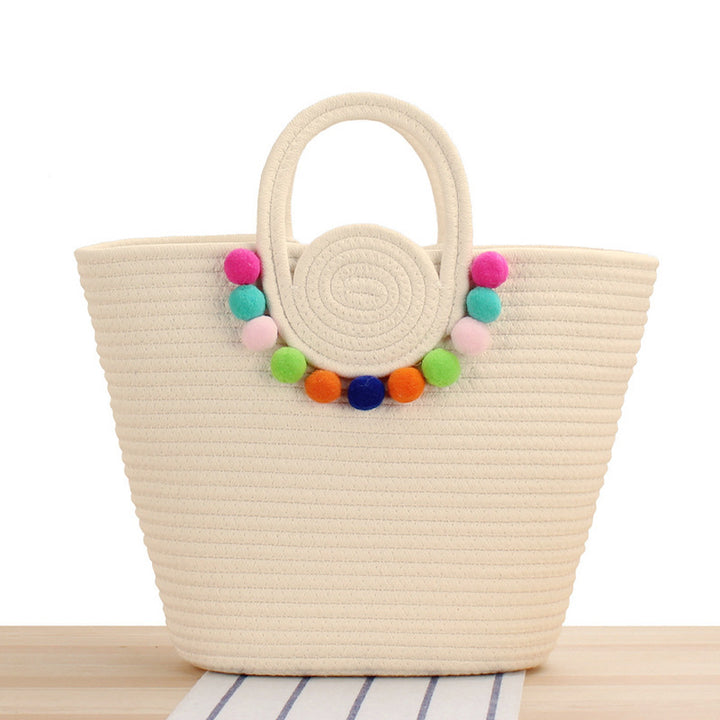 Fashionable handbag with playful pompom decoration Bowlift