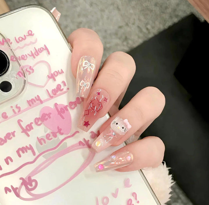 Decorative Long Stiletto Press-On Nails with Heart and Floral Accents Bowlift